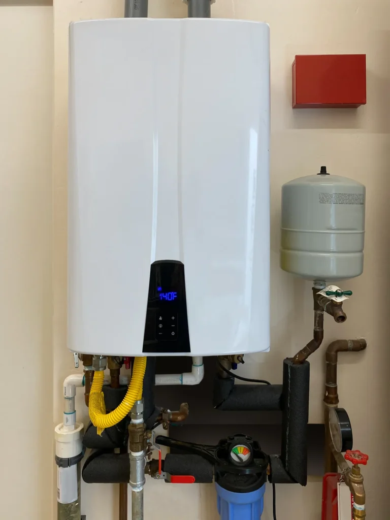 High-efficiency tankless water heater installed in a home in Blue Springs, MO, providing on-demand hot water and energy savings.