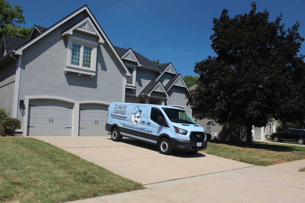 A van parked in front of a residential house