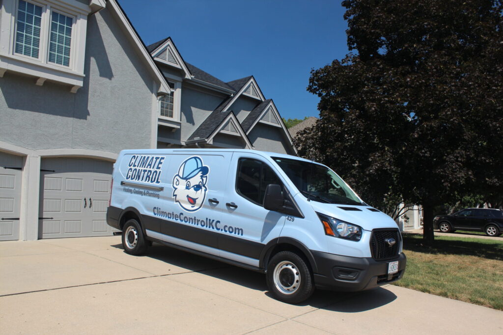 A van parked in front of a residential house